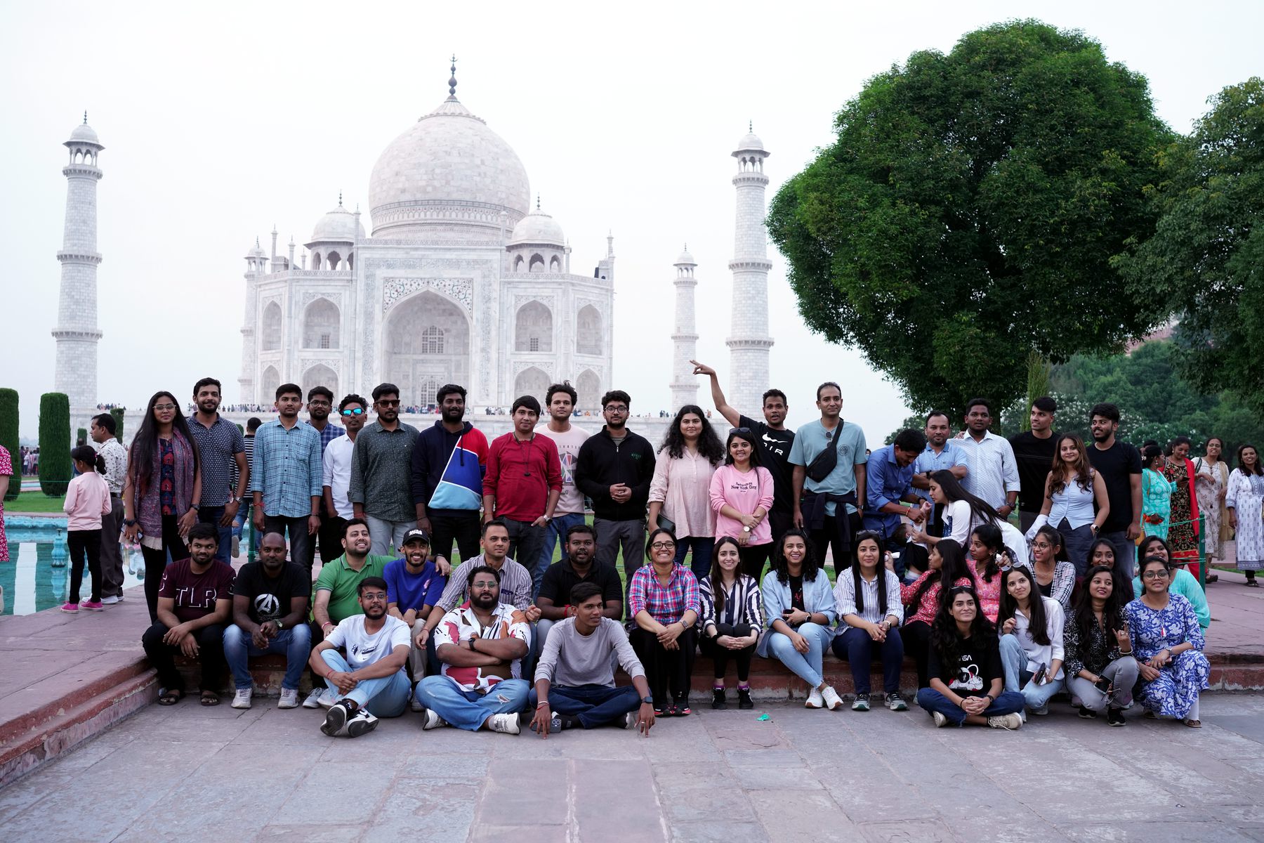 The QDE team on an offsite, gathered in front of the Taj Mahal